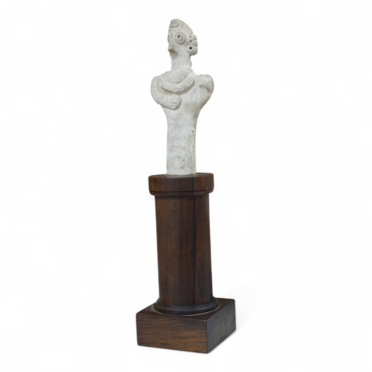 A Syro-Hittite pottery figure, on columnar rosewood stand, 29cm high